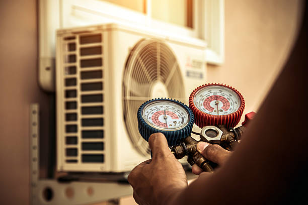 Professional Air Conditioning Service technician working in Lansdale, PA